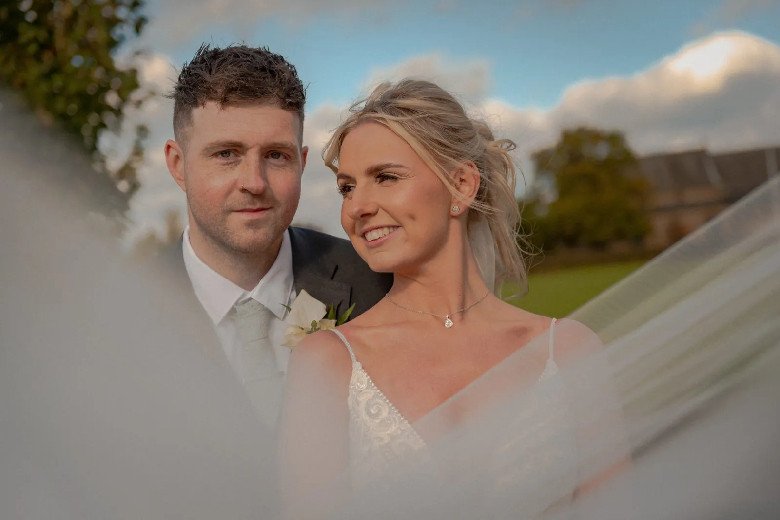Bride and groom in golden hour light, the long Wyre valley evenings near Garstang