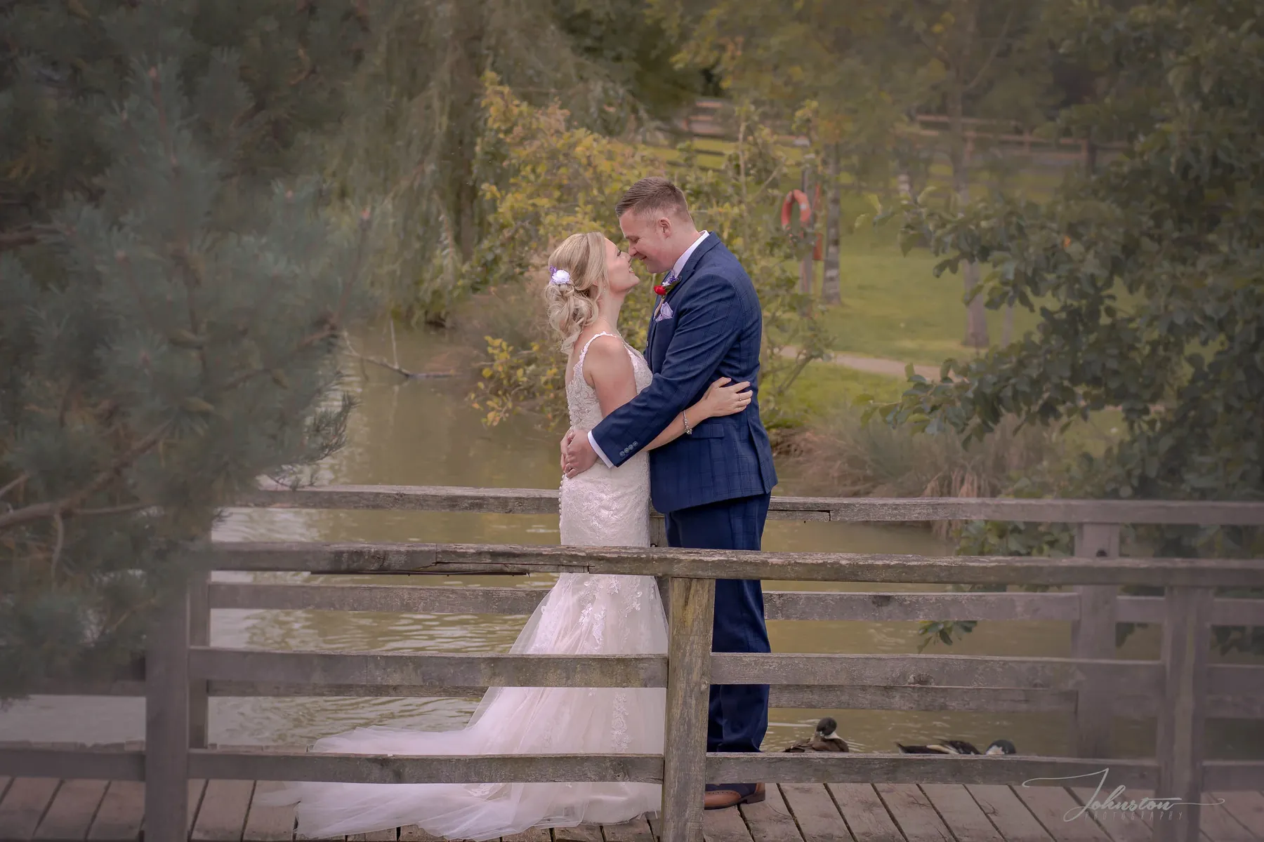 Bride and groom on a footbridge, riverside portraits near Longridge and Ribchester
